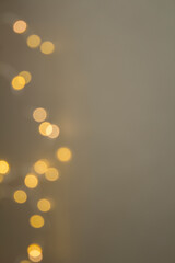 Festive gray background of glowing garland with copy space