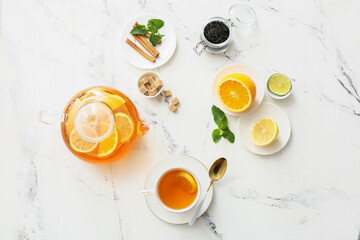 Composition with cup of hot healthy beverage on light background