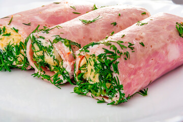 Ham rolls stuffed with cheese, garlic and mayonnaise. Close-up of ham and cheese rolls for design and project.