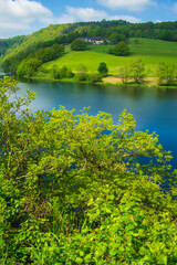 Rursee at Eifel National Park, Germany. Scenic view of lake Rursee and surrounded green hills in North Rhine-Westphalia