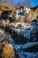 Fototapeta na wymiar Frozen waterfall in Dovrefjell in Norway