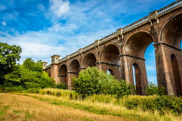Obraz premium A view of the northern section of the Ouse Valley viaduct in Sussex, UK on a summers day