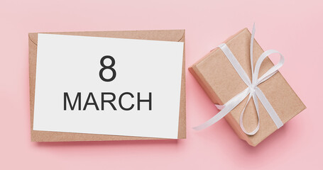 Gifts with note letter on isolated pink background, love and valentine concept with text 8 march