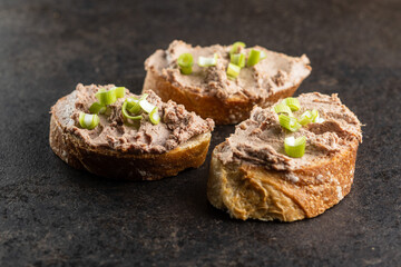 Liver pate on sliced baguette.