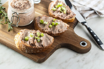 Liver pate on sliced baguette.