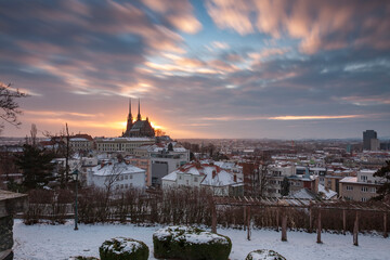 Obraz premium Panoramic view of the The Cathedral of Saints Peter and Paul in Brno in Czech Republic. Long exposure, used neutral density filter at winter sunrise time. View from Spilberk Castle