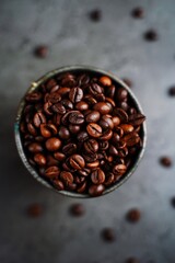 Coffee beans background on dark moody setting, selective focus