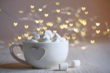 white cup with heart and lace lights, marshmallow