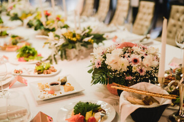 Catering banquet table at wedding reception. Restaurant presentation, european cuisine, food consumption, party concept. Food styling, appetizers bar, welcome drink, event design.