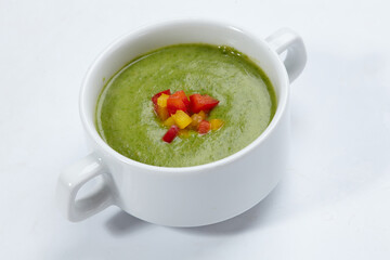 green cream soup on white background
