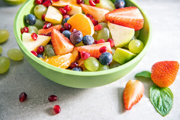 Portion fruit salad in a bowl . Healthy meal