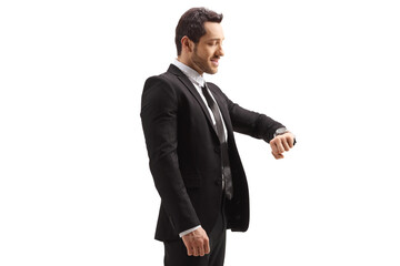 Man in a suit checking his watch
