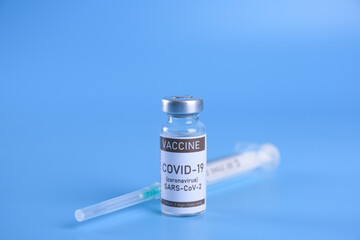 Coronavirus vaccine - The medical concept. Ampoule with Covid-19, SARS-Cov-2 vaccine. Copyspace....
