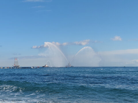 Fire Fighters Boat Spraying Water

