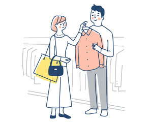 洋服の買い物を楽しむカップル