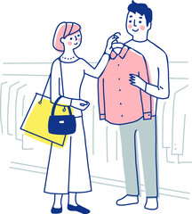 洋服の買い物を楽しむカップル