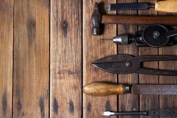Old working tools. Vintage working tools  on wooden background
