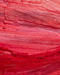 Close up Texture Red color paint, visible pattern of brush strokes. 