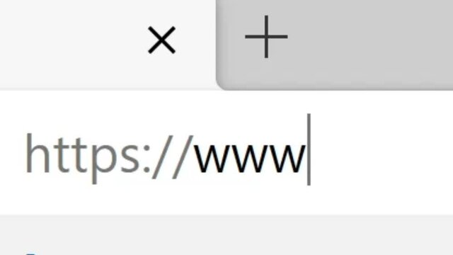 Typing HTTPS://www. Into Address Bar. Searching For an Online Network Website. Searching The World Wide Web Internet on a Computer. Monitor Screen View of Search for a Webpage.