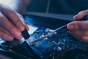 computer hardware engineering. technology science concept. developer soldering electronic component