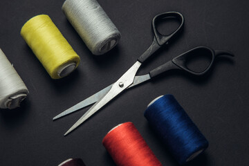 Colorful sewing threads and scissors