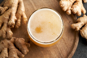 Probiotic drink with ginger on a table, top view