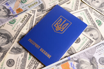 Passport of a citizen of Ukraine against the background of American dollars.
