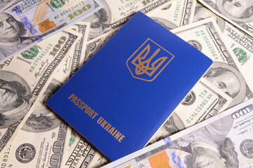 Passport of a citizen of Ukraine against the background of American dollars.