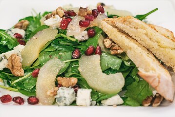 Pear Salad with Dried Cherries, Candied Walnuts and gorgonzola cheese. Caramelized pear salad