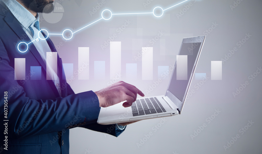 Poster man holding laptop computer and graph