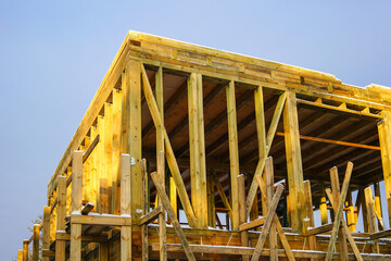 natural wooden construction on the construction site of a two-storey residential house
