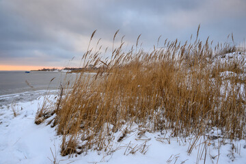 Snowy dunes, winter landscape at Jastarnia beach. Hel Peninsula. Baltic Sea. Poland