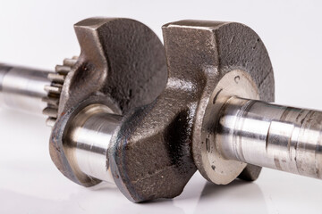 Crankshaft of a small internal combustion engine. Spare parts for engine repair and regeneration.