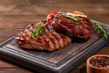 Fresh juicy delicious beef steak on a dark background