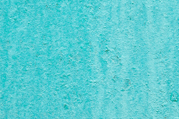 Grunge background of turquoise. Old vintage wall covered in paint