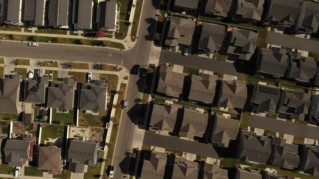 Aerial shot looking down on dense suburban housing development