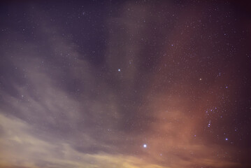 Stars Sirius and Procyon near the constellation Orion in the foggy night.