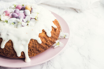 Glazed easter cake with flowers and candy