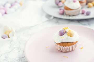 Glazed Easter cupcakes decorated with mini chocolate eggs