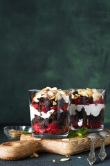 Dessert black forest with cherries in a glass on a wooden board. Traditional German dessert.
