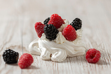 Pavlova cake on a glass plate. Festive dessert. Copy space. 