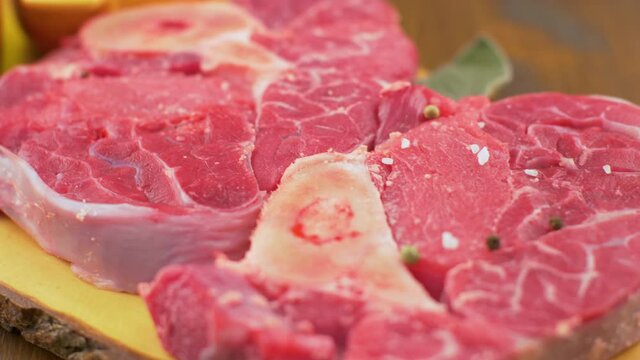 couple of delicious braised veal on wood board with pepper and salt