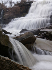 Long exposure capture with a focus on the small waterfall and rocks at the bottom left of the image.