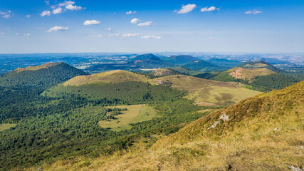 Naklejka premium View on the Chaine des Puys volcanoes range from the top of the Puy de Dome, the most famous volcano this range, in Auvergne, France