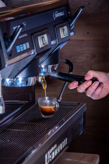 coffee maker pouring espresso