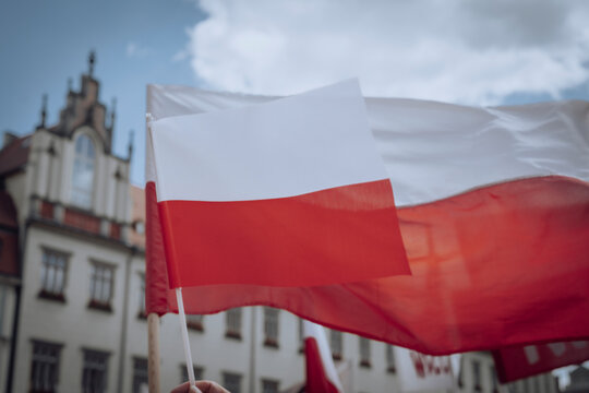 The Polish flag waving in the wind against the sky