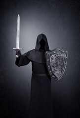 Ghostly figure with medieval sword and shield in the dark