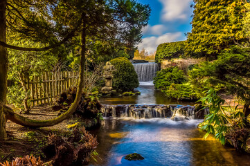 A long exposure view of a waterfall and weir at Newstead Park, Nottinghamshire, UK