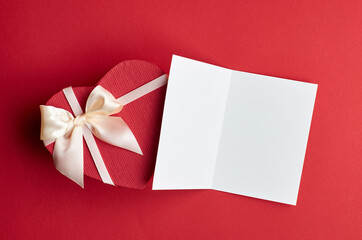 Valentines day card mockup with heart gift box on red paper background