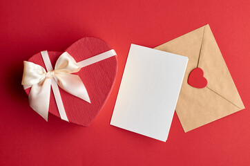 Valentines day card mockup with envelope and heart gift box on red paper background